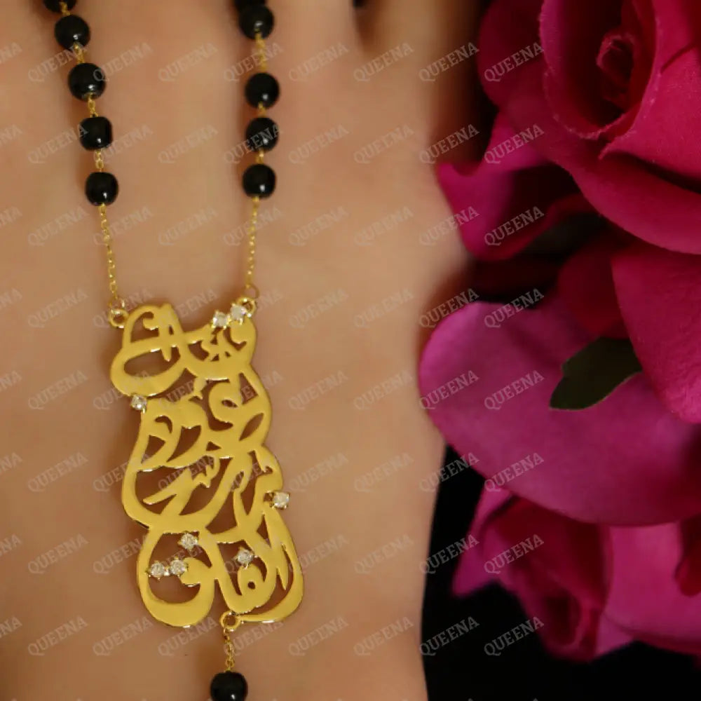 Luxurious ’Qul a3oz bi rab Al Falaq’ In Arabic Calligraphy with Black beads ROSARY necklace With Hamsa Hand Charm