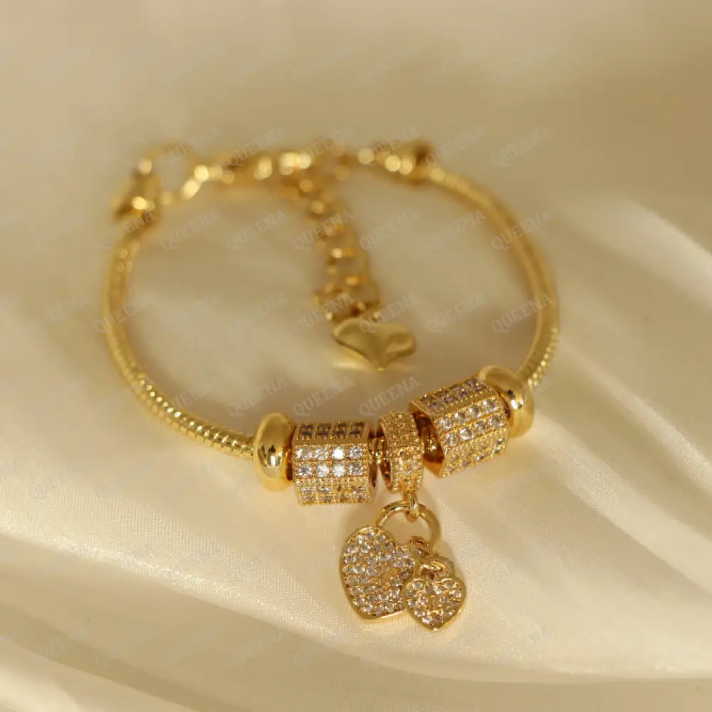 Luxury Golden Heart Charms Bracelet Studded With Zircon Stones