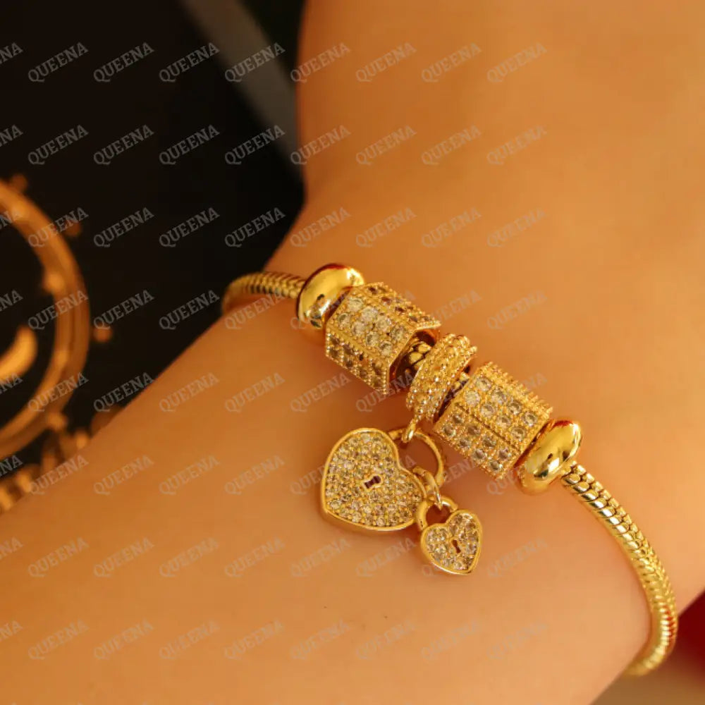Luxury Golden Heart Charms Bracelet Studded With Zircon Stones