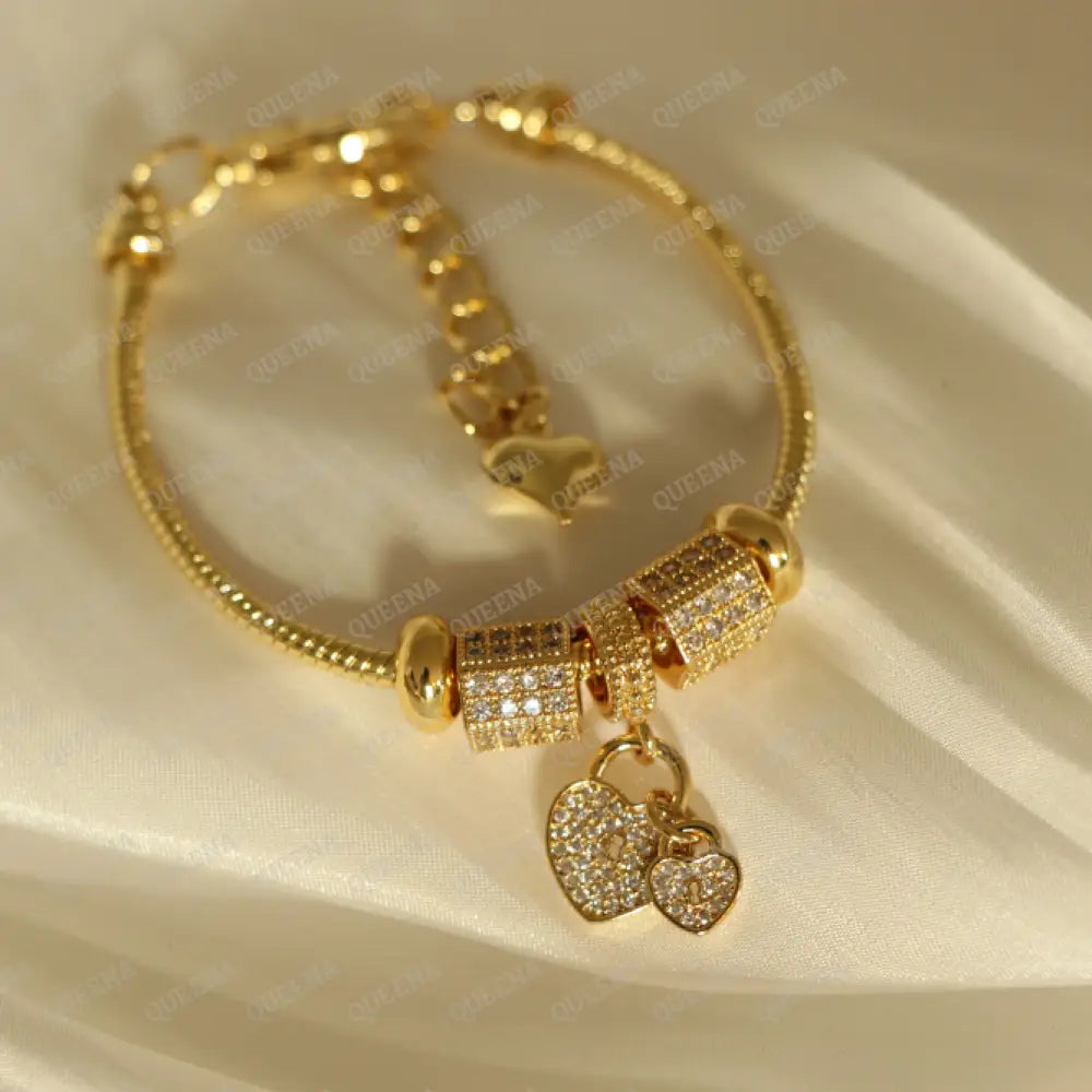Luxury Golden Heart Charms Bracelet Studded With Zircon Stones