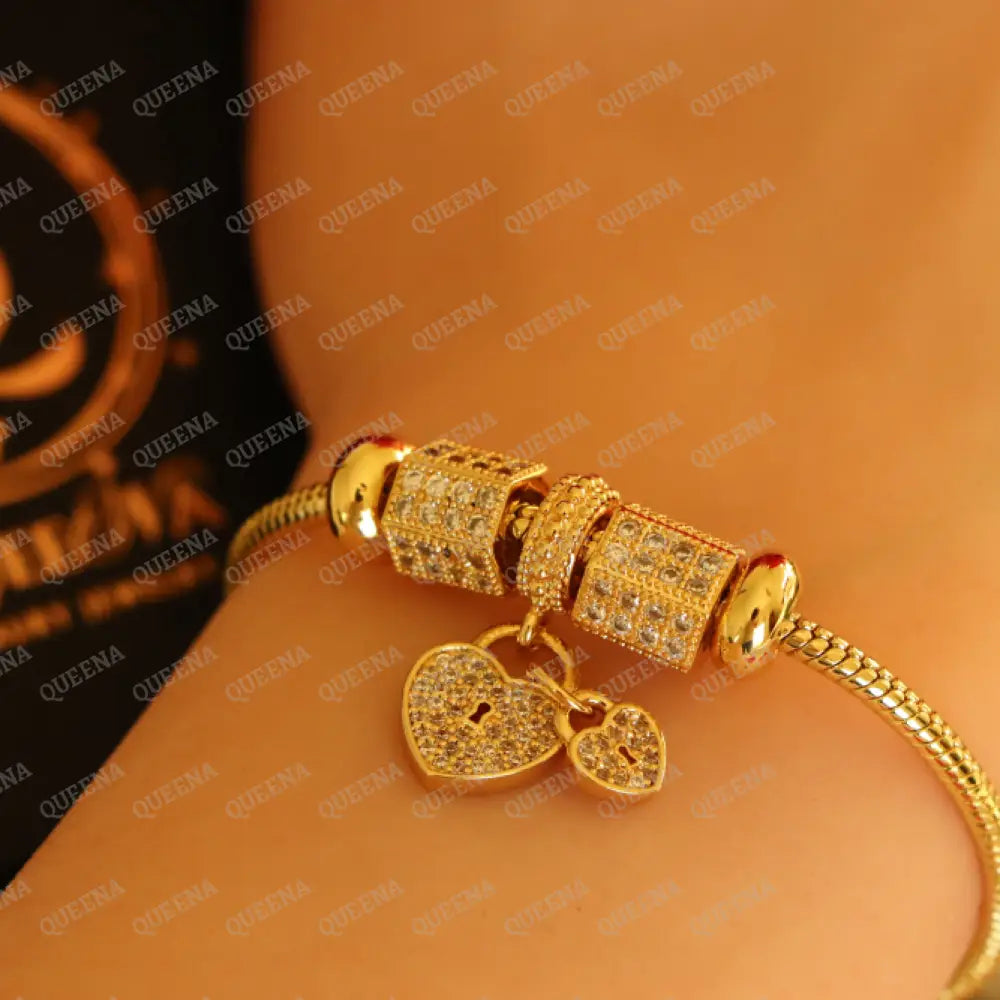 Luxury Golden Heart Charms Bracelet Studded With Zircon Stones