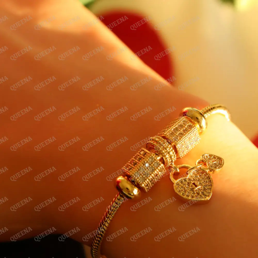 Luxury Golden Heart Charms Bracelet Studded With Zircon Stones