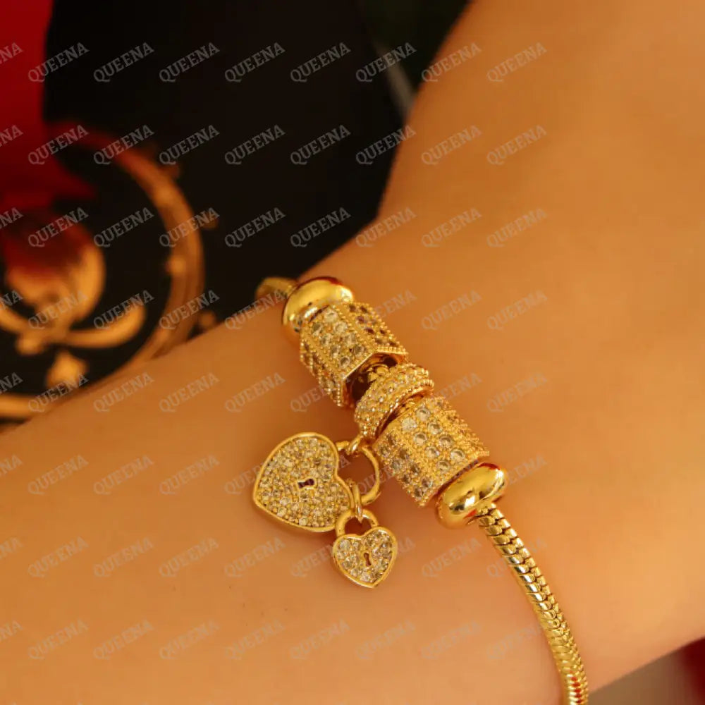 Luxury Golden Heart Charms Bracelet Studded With Zircon Stones