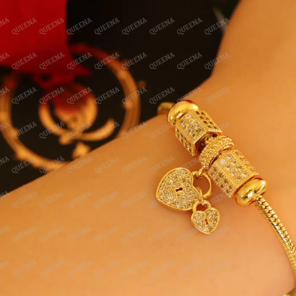Luxury Golden Heart Charms Bracelet Studded With Zircon Stones