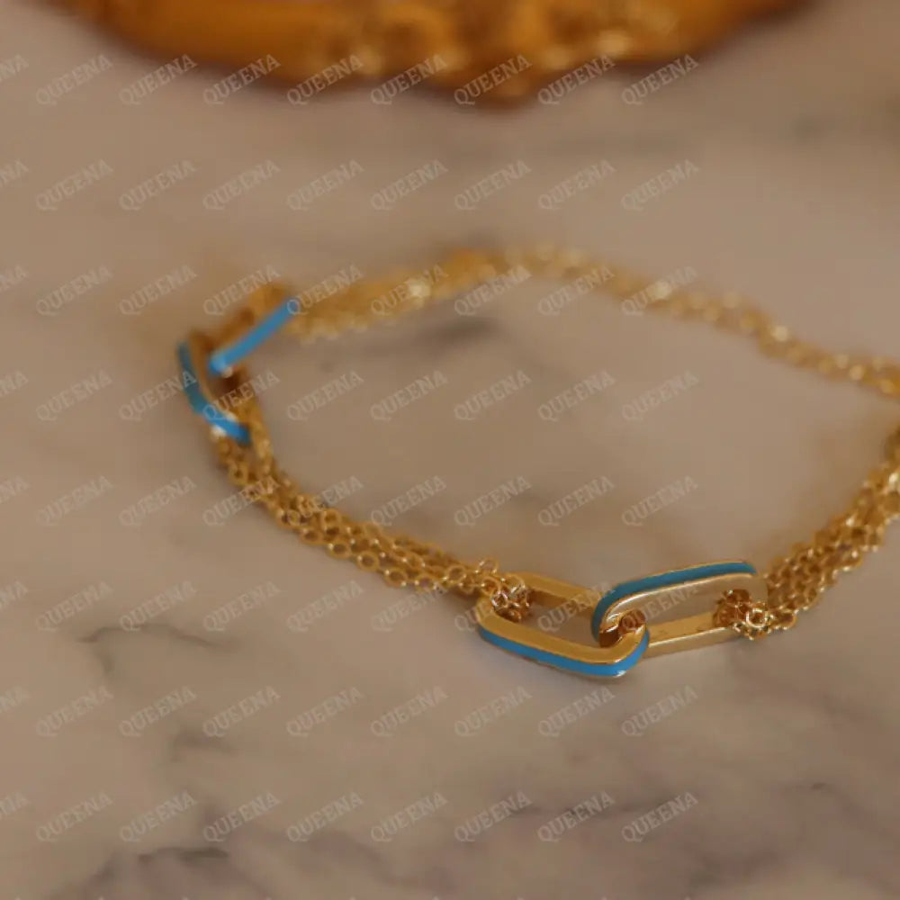 Double Interlocking Paperclip Link Chain Bracelet In Yellow Gold With A Blue Turquoise Touch