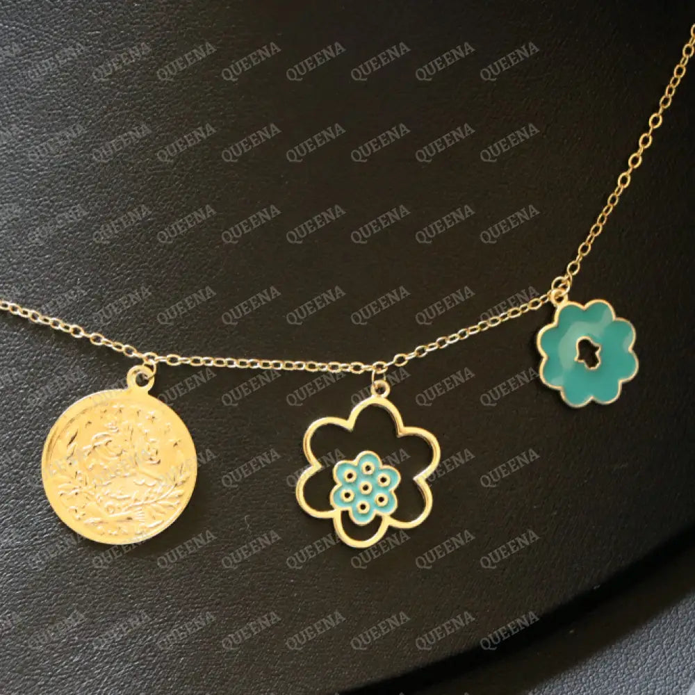 Golden and Turquoise Charms Necklace with coins and a hamsa hand pendants Necklaces