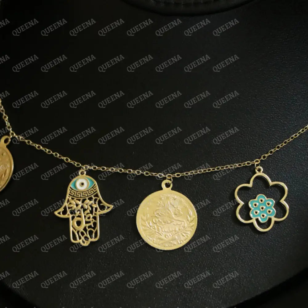 Golden and Turquoise Charms Necklace with coins and a hamsa hand pendants Necklaces