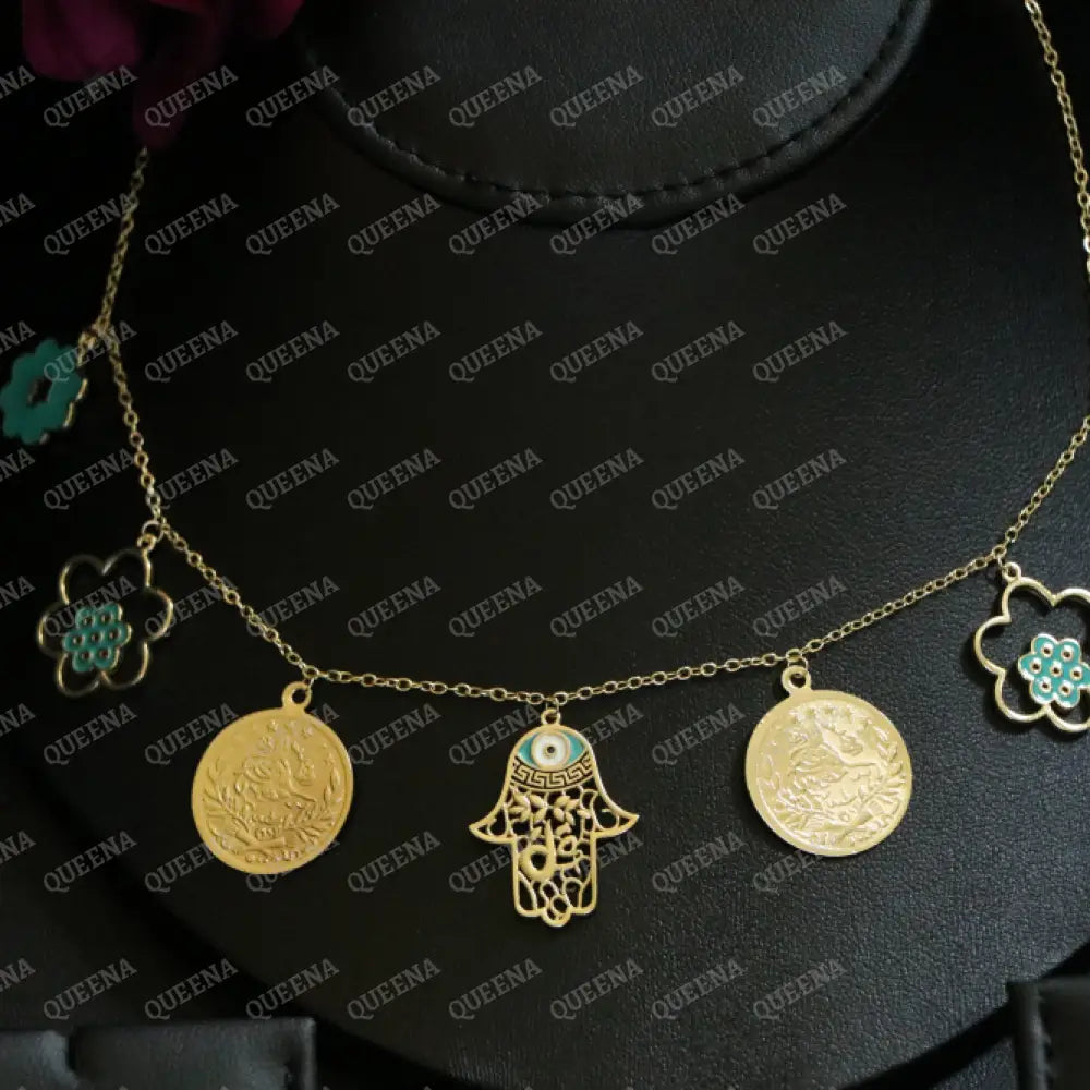 Golden and Turquoise Charms Necklace with coins and a hamsa hand pendants Necklaces