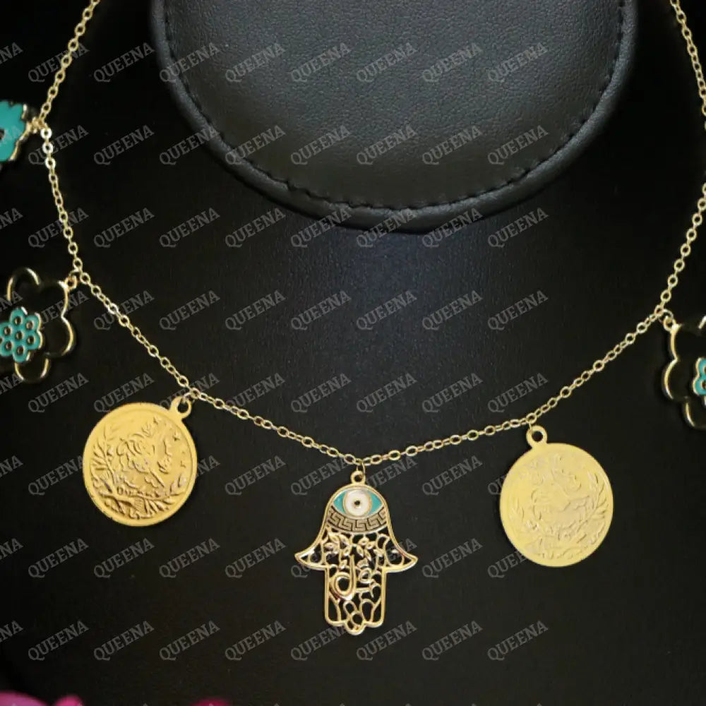 Golden and Turquoise Charms Necklace with coins and a hamsa hand pendants Necklaces