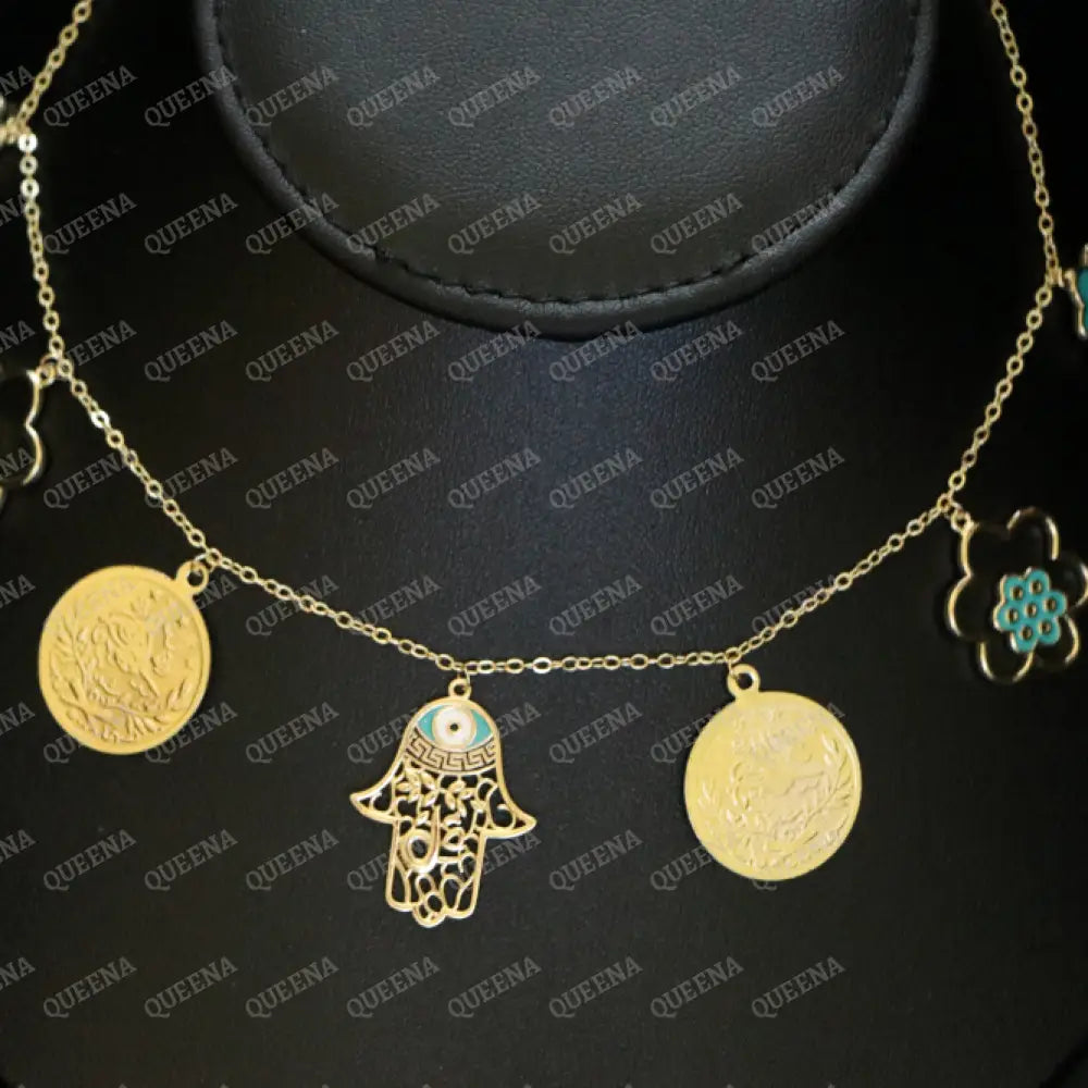 Golden and Turquoise Charms Necklace with coins and a hamsa hand pendants Necklaces