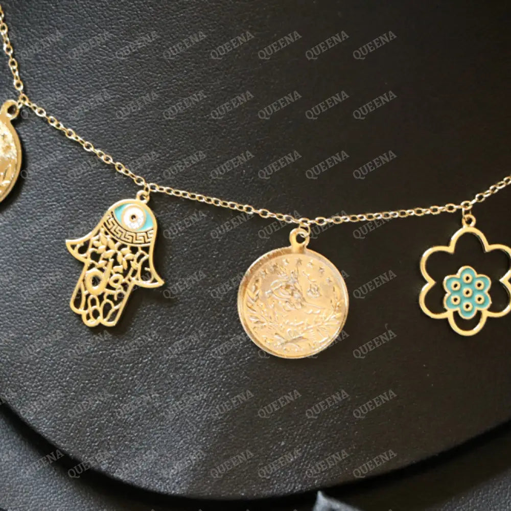 Golden and Turquoise Charms Necklace with coins and a hamsa hand pendants Necklaces
