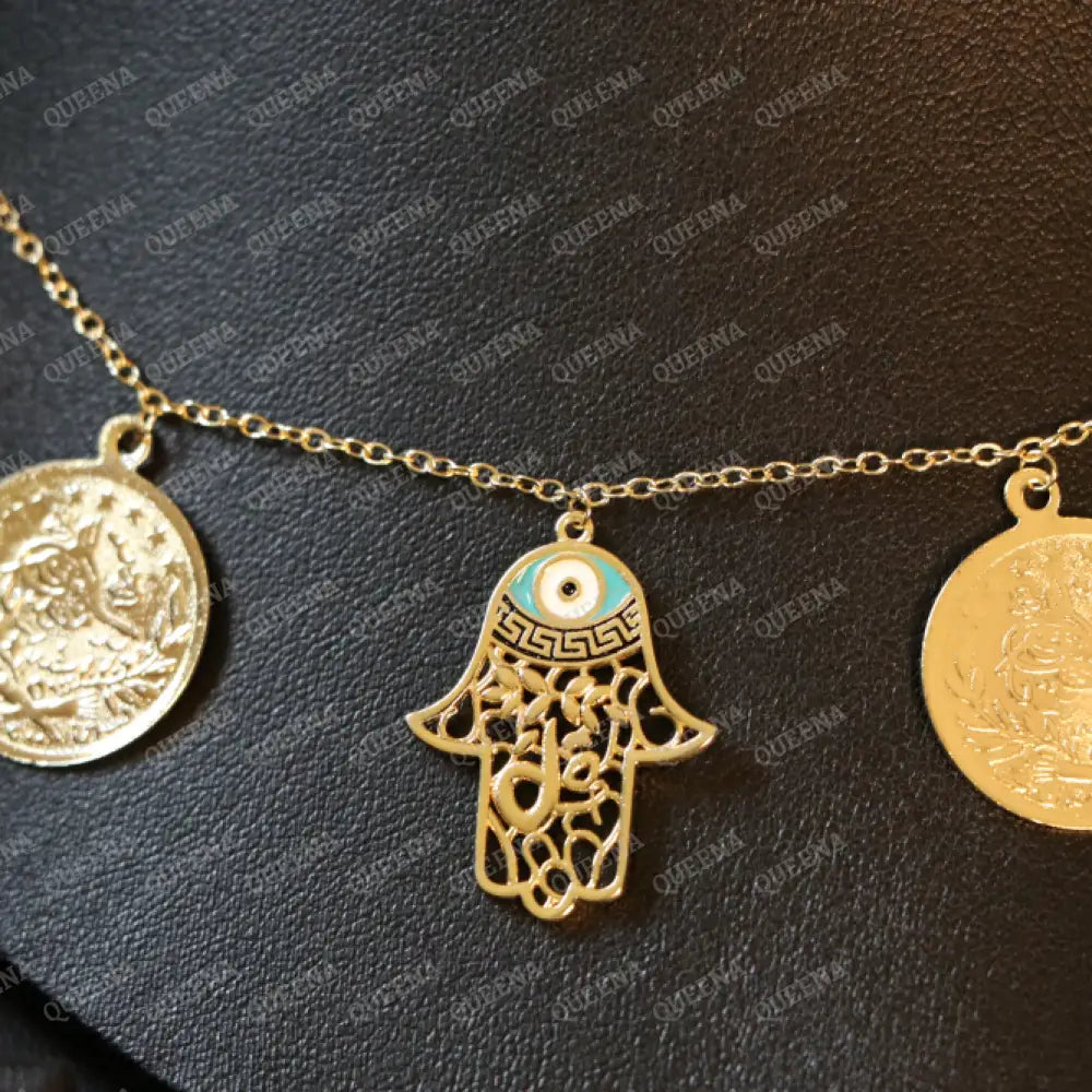 Golden and Turquoise Charms Necklace with coins and a hamsa hand pendants Necklaces