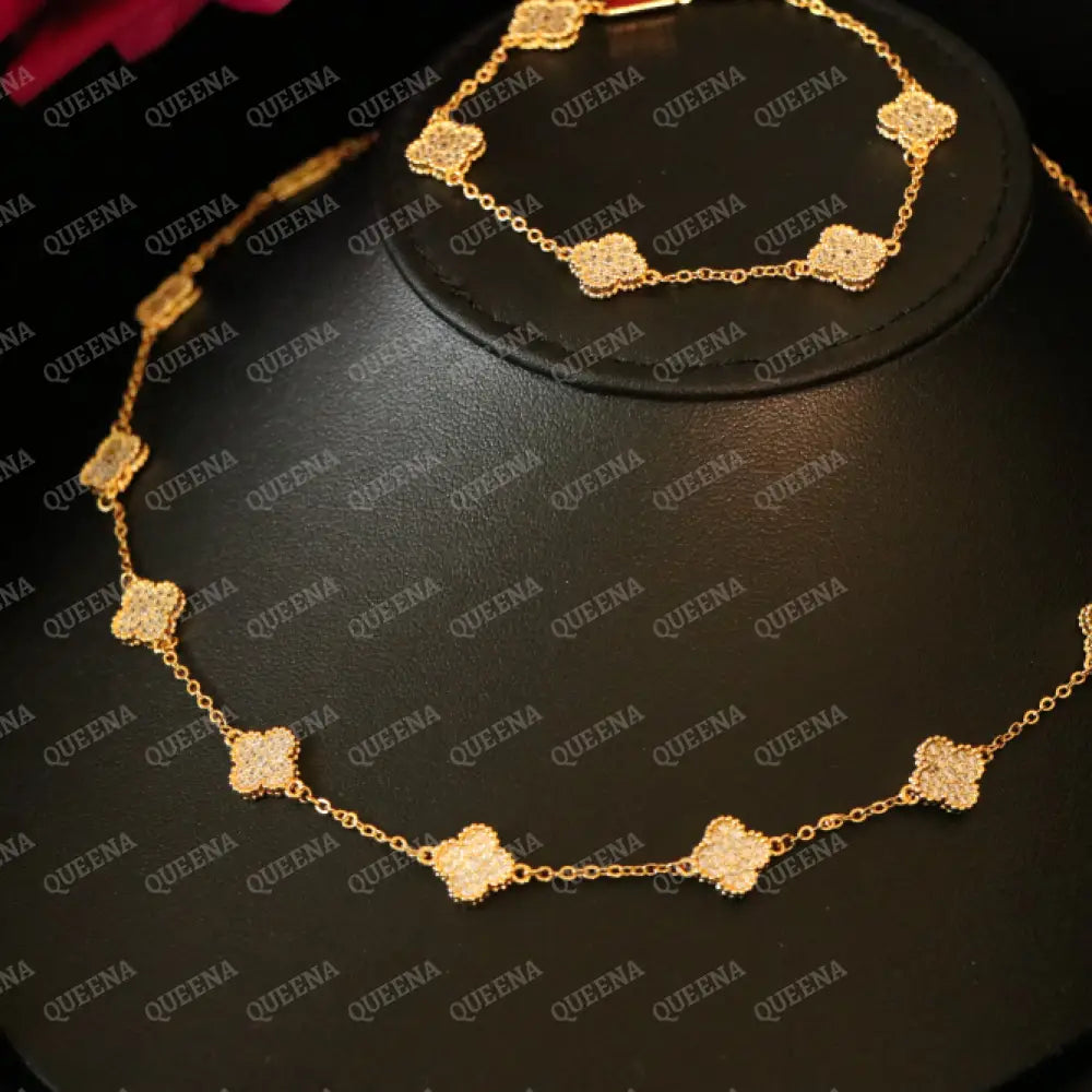 Luxury Golden ROSA Floral Jewelry Set with 10 Mini Clover Flowers (Necklace + Bracelet) Studded with Full Zircon